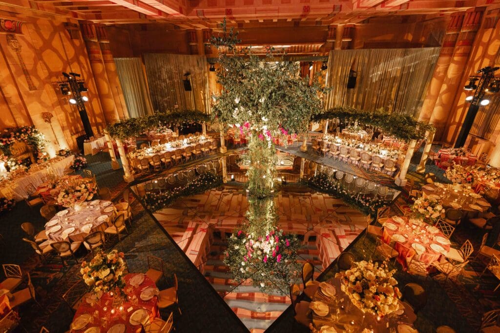 Fox Theatre in Atlanta GA, wide room shot of a Parisian garden theme event with a statement 15 foot tree in the middle of the diamond shape dance floor